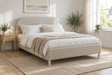 Belgravia stone boucle ottoman bed, shown in a bright UK bedroom