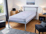 Bermondsey silver metal bed frame, in a bright bedroom by a window