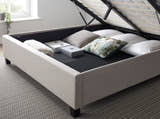 Tooting fabric ottoman bed in oatmeal, inside the fully boarded storage