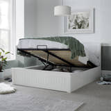 Acton wooden ottoman bed in white, with the gas lift storage open