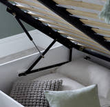 Acton wooden ottoman bed in white, the gas struts and storage