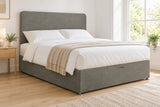Grey suede divan bed base with 2 drawers and a curved headboard, in a bright UK bedroom (bedding for illustration, mattress not included)