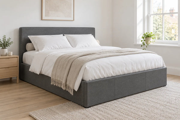 Fulham grey ottoman bed with a low headboard, shown in a bright UK bedroom