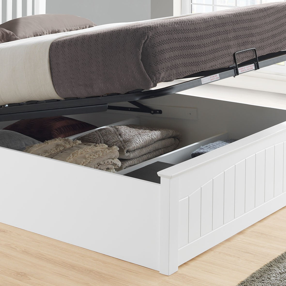 Barnet wooden ottoman bed in white, storage open, close-up