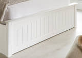 Barnet wooden ottoman bed in white, the panelled foot end