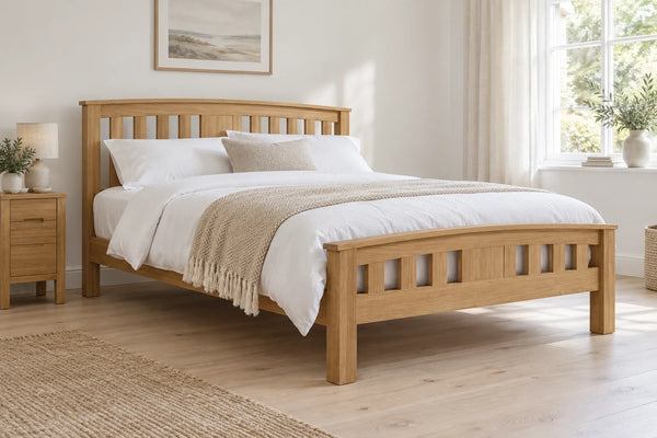 Greenwich solid oak super king bed, shown in a bright UK bedroom