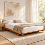 Barbican Japanese style low bed in solid pine, medium finish, in a bright bedroom (AI-generated illustration of this frame; bedding for illustration, mattress not included)