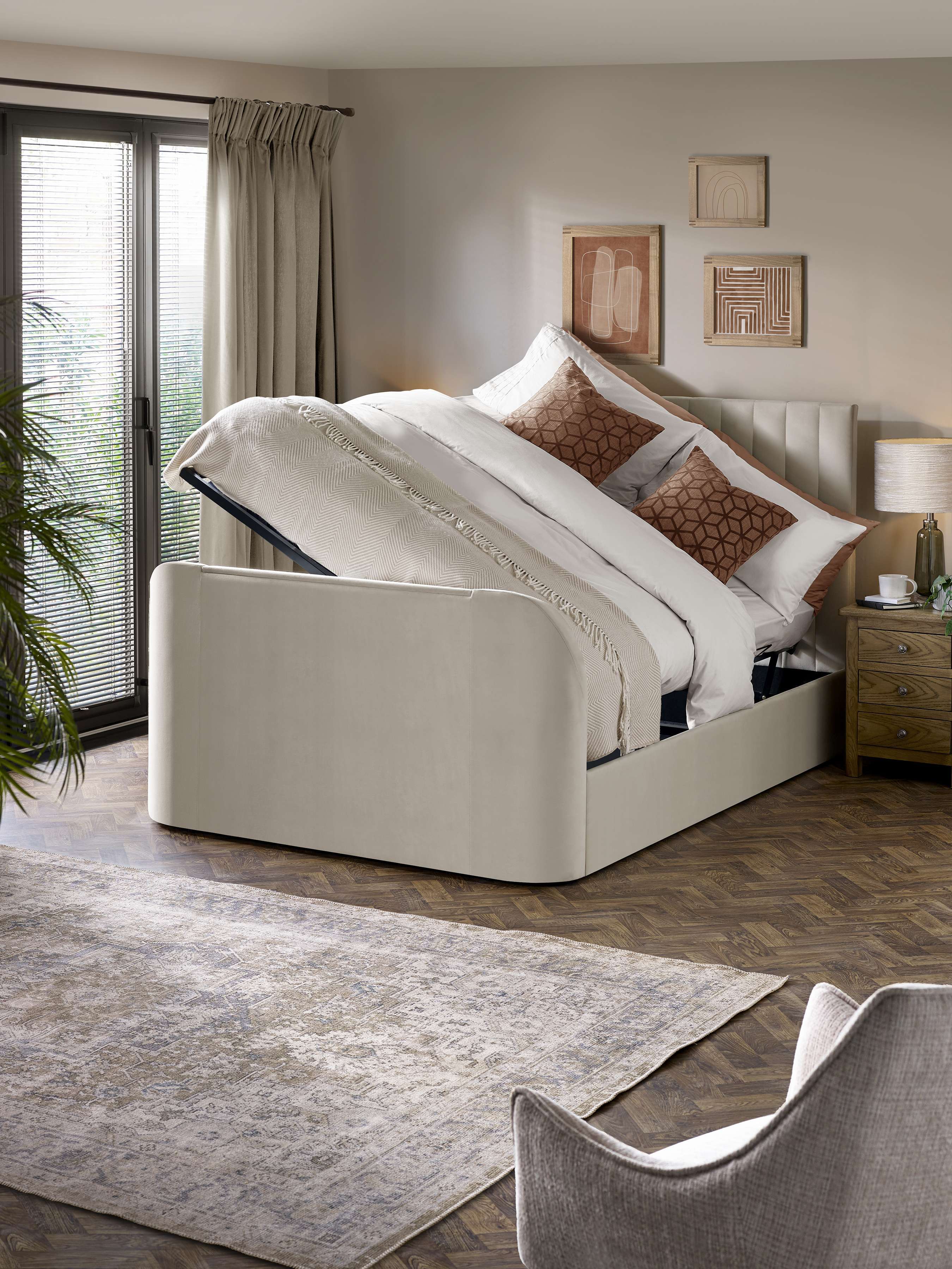 Julian Bowen Alana TV bed with the side lift ottoman open, in a bedroom