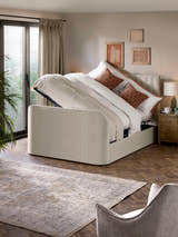 Julian Bowen Alana TV bed with the side lift ottoman open, in a bedroom