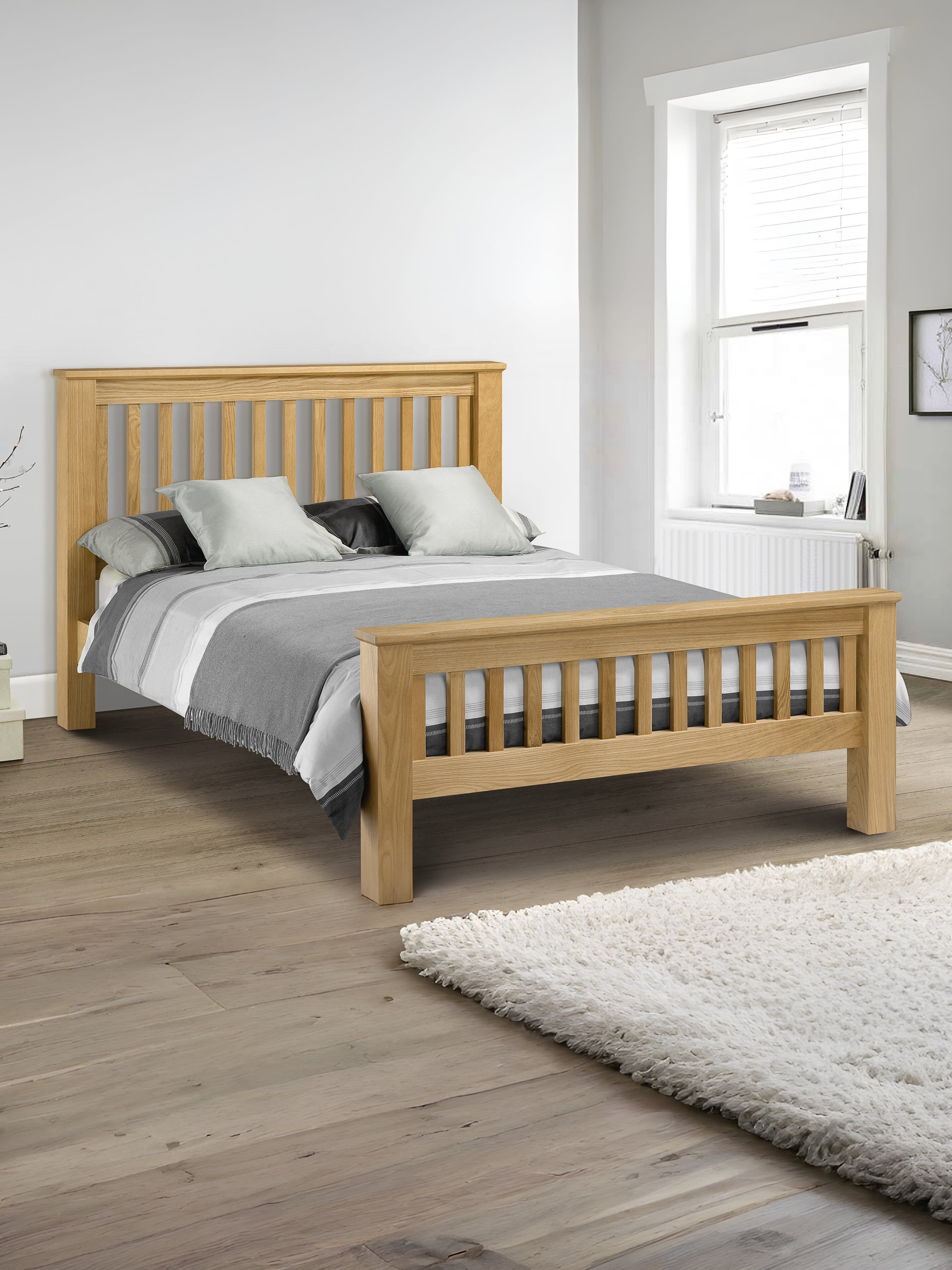 Julian Bowen Amsterdam high footend bed in light oak, in a bright bedroom