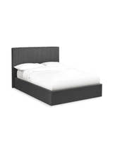 Julian Bowen Aylen dark grey linen ottoman bed made up with white bedding, on a white background