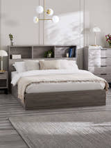 Julian Bowen Bali ottoman bed in grey oak effect with a bookcase headboard, in a bedroom