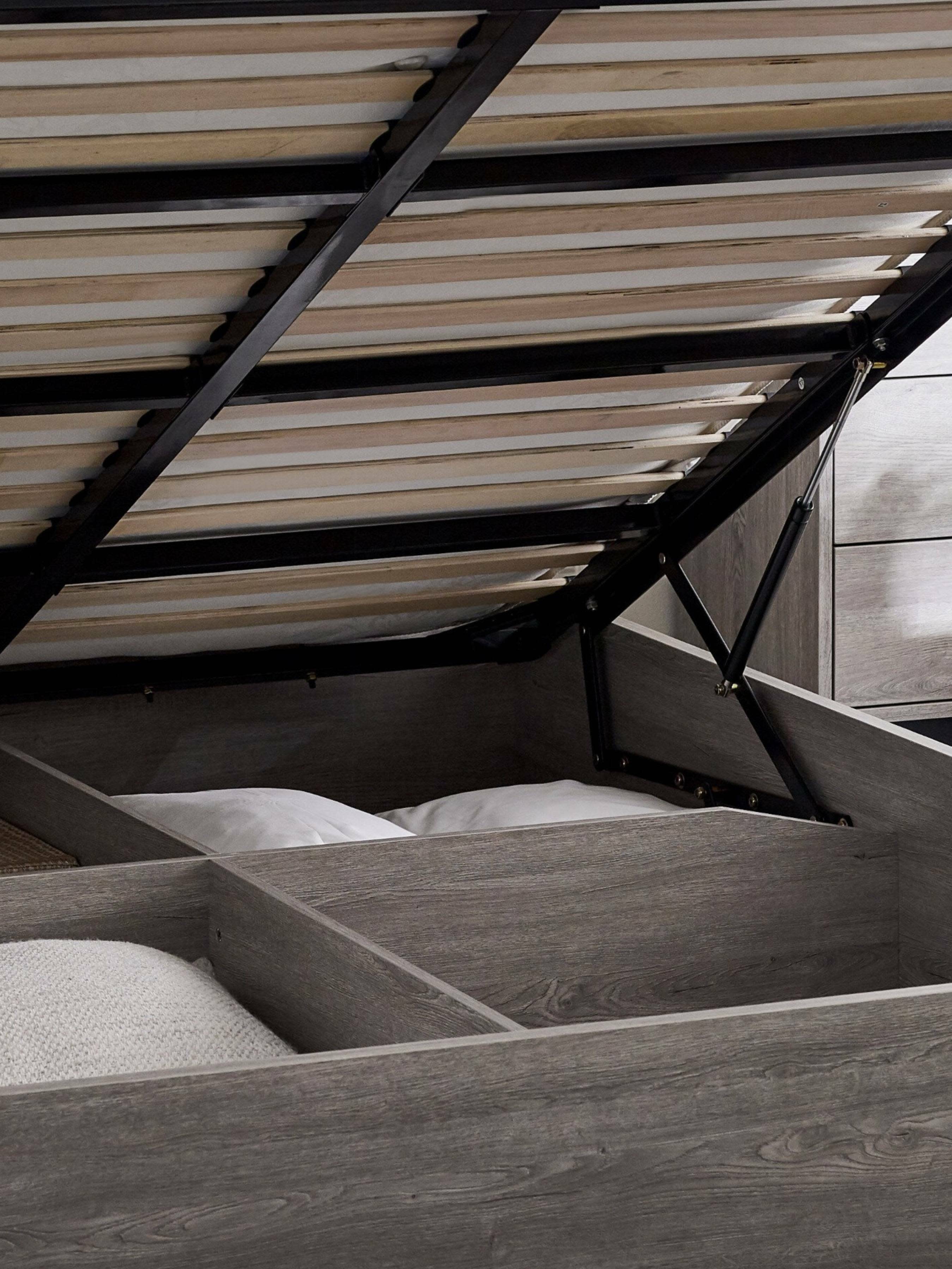 Bali ottoman bed: gas struts and slatted base lifted over the storage, close up