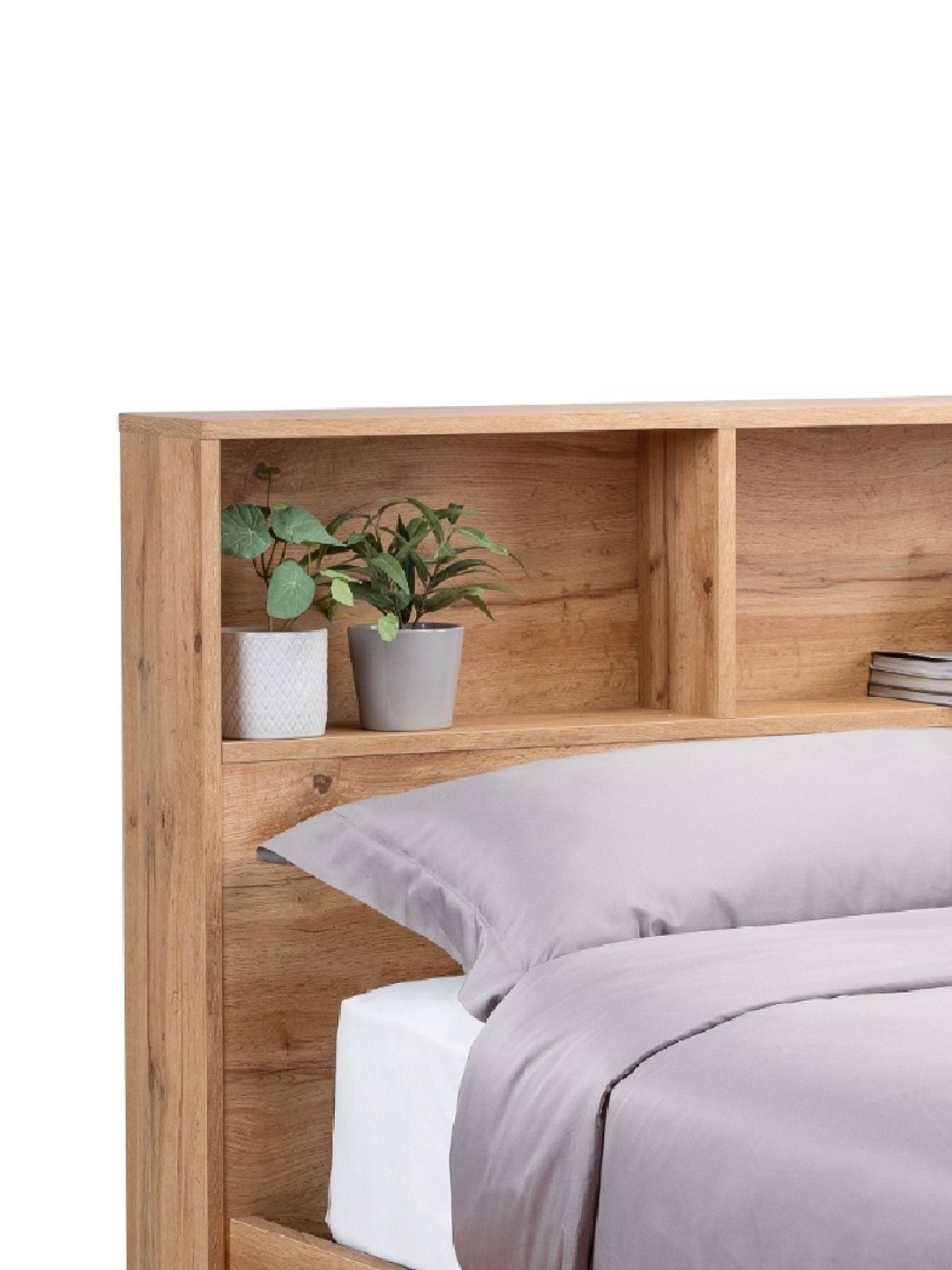 Bali ottoman bed: light oak effect bookcase headboard with plants on the shelves, close up