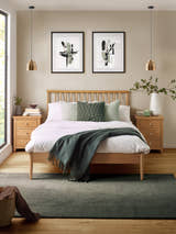 Julian Bowen Belton oak spindle bed, in a bedroom