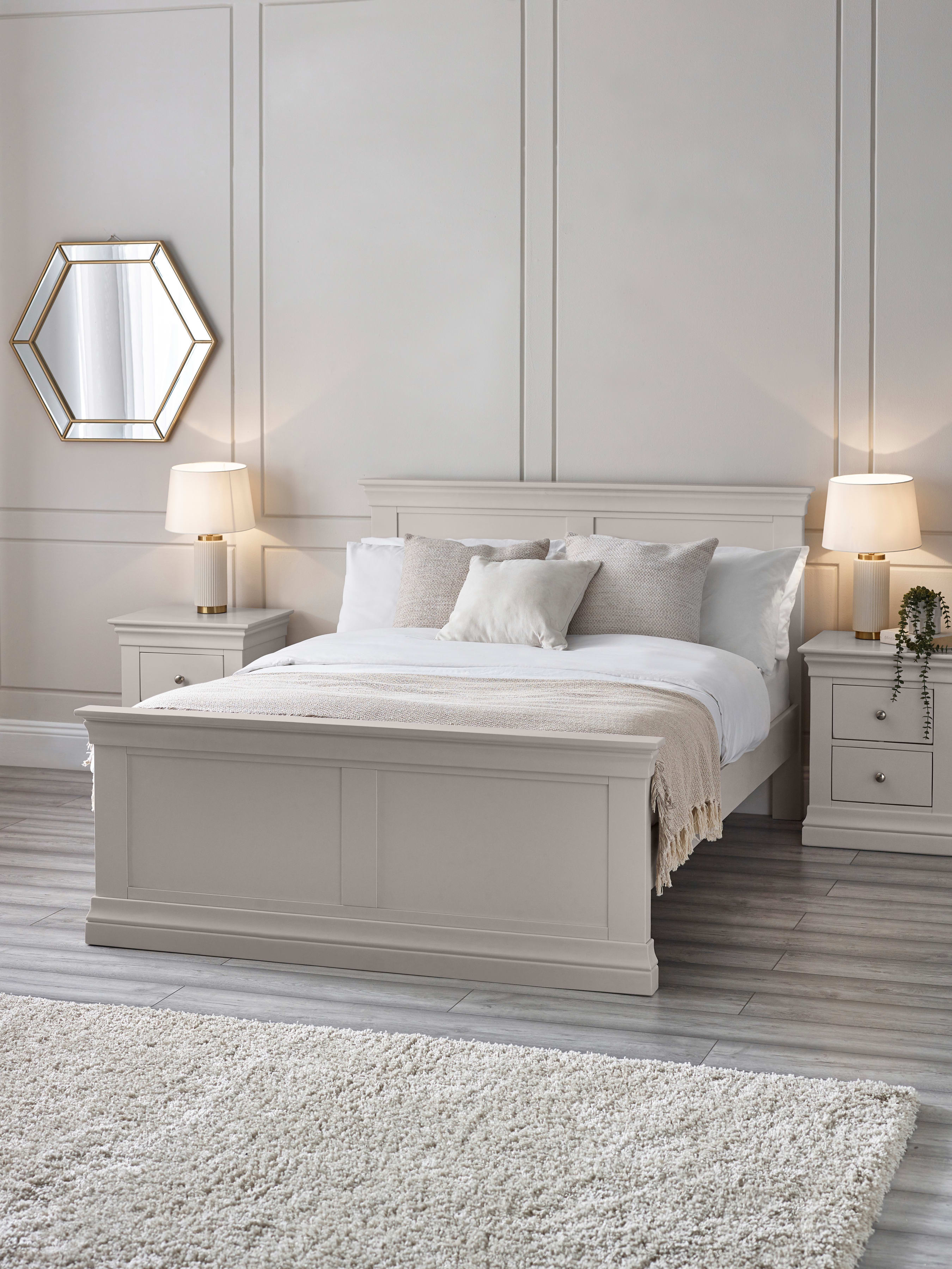 Julian Bowen Clermont bed in light grey, in a bedroom with panelled walls and bedside lamps