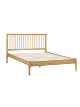 Julian Bowen Cotswold oak bed frame with its slats, on a white background