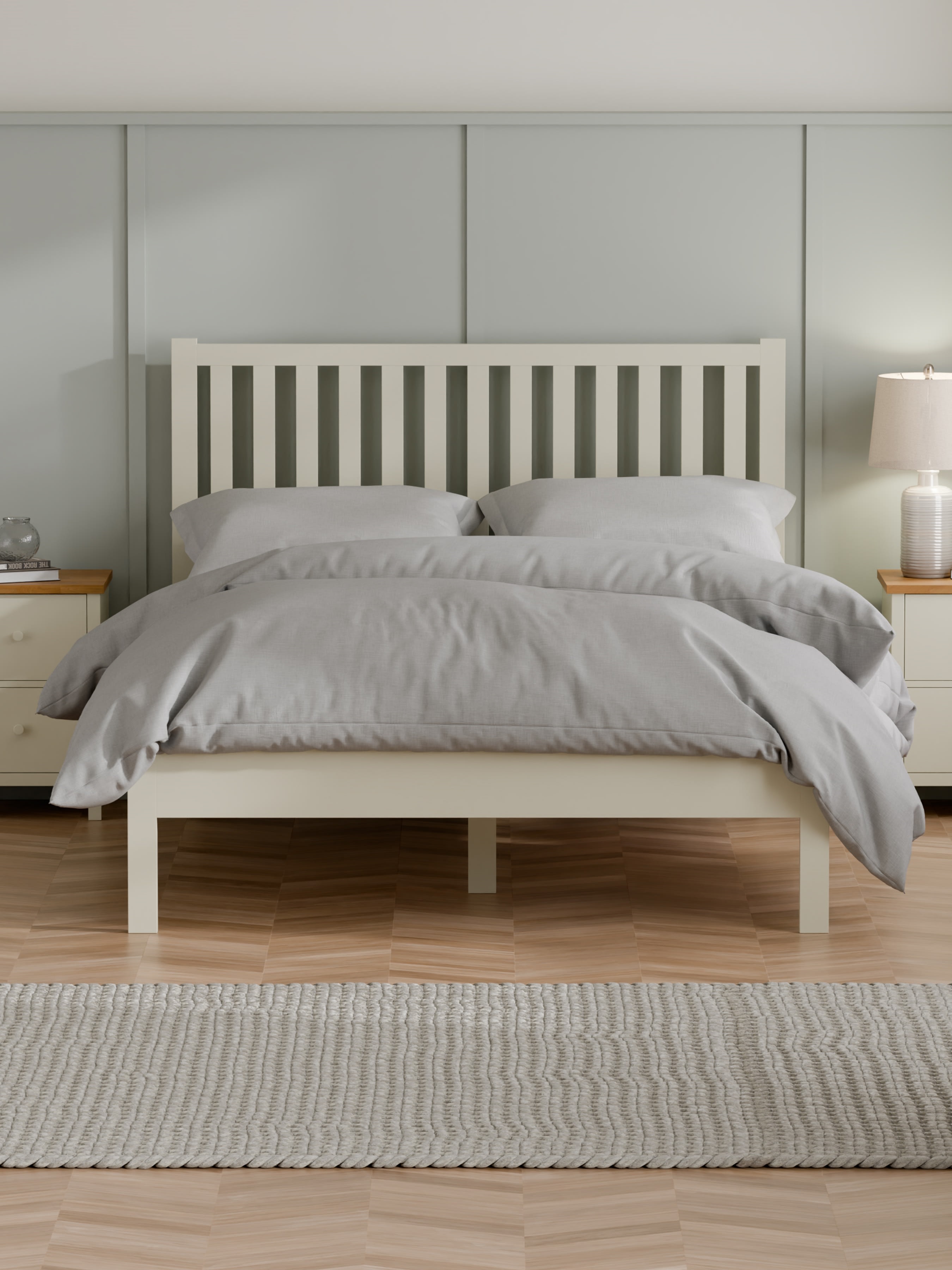 Julian Bowen Coxmoor bed in ivory with a tall slatted headboard, in a bedroom
