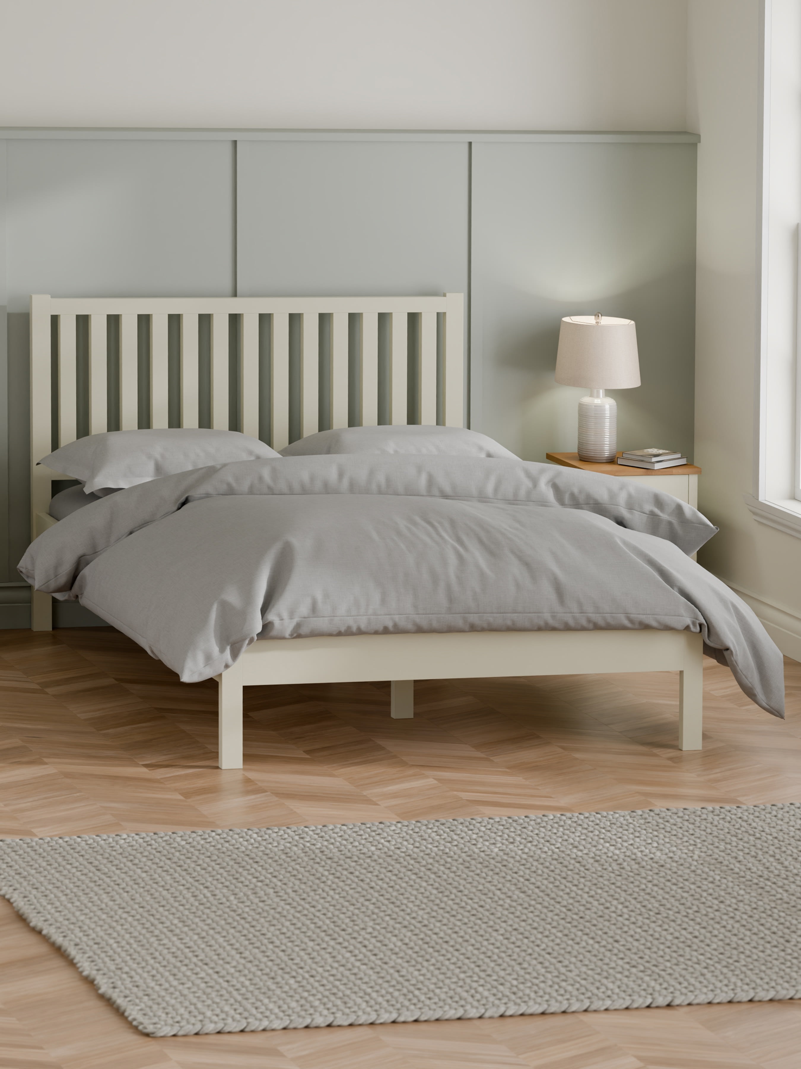 Julian Bowen Coxmoor ivory bed with grey bedding in a panelled bedroom