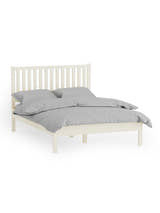 Julian Bowen Coxmoor ivory bed made up with grey bedding, on a white background