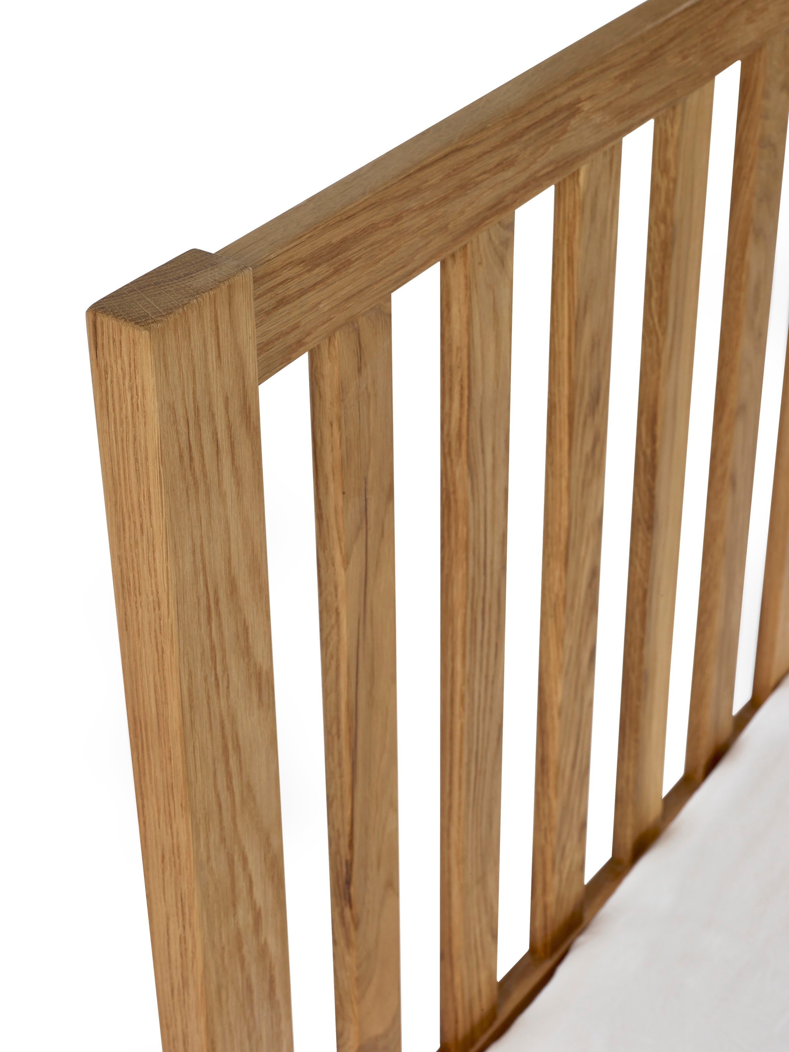 Coxmoor bed: top rail and slats of the oak headboard, close up