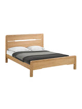 Julian Bowen Curve oak bed made up with grey bedding, on a white background