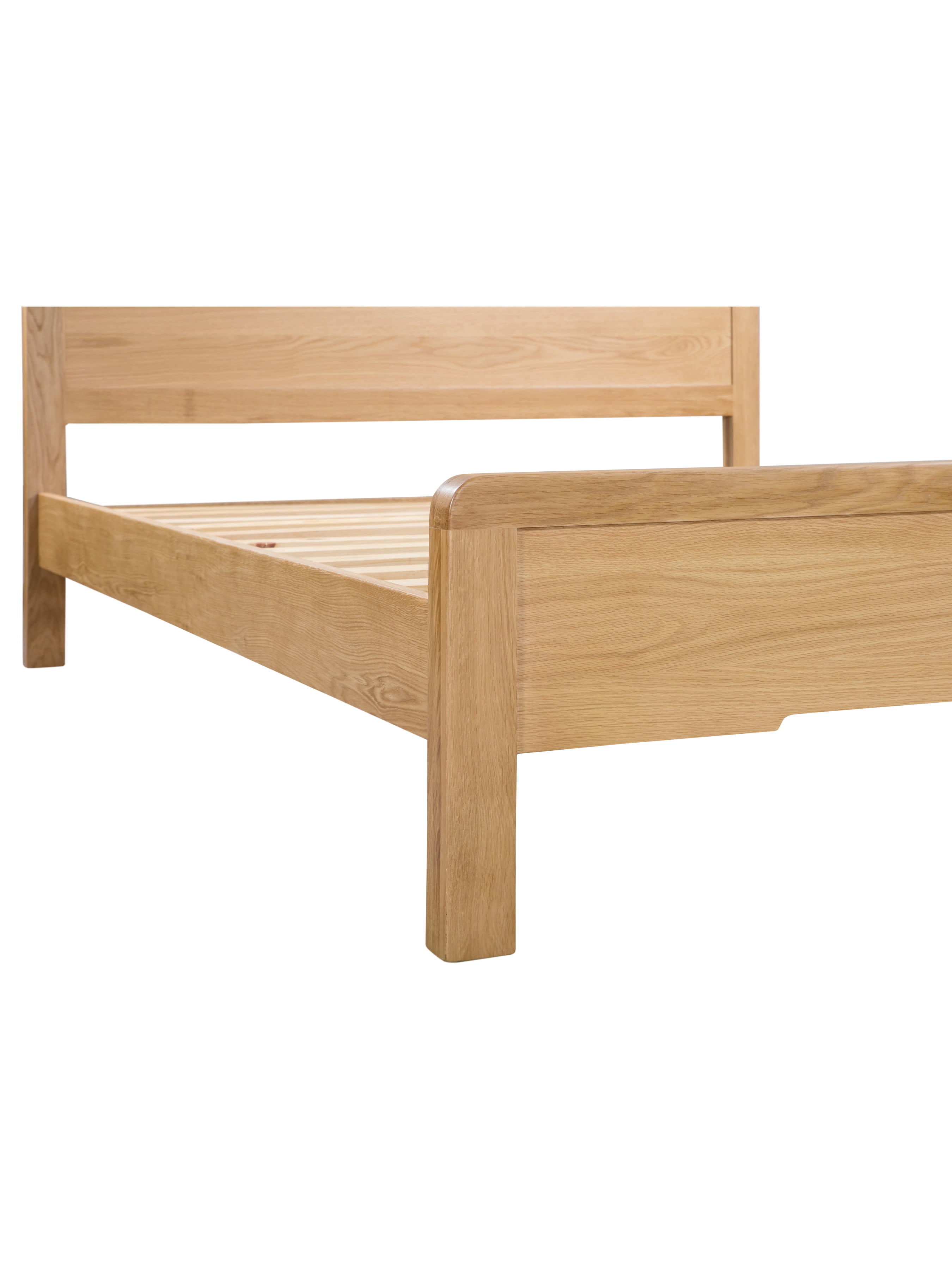 Curve bed: oak footboard and leg with softly curved corners, close up