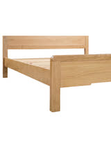 Curve bed: oak footboard and leg with softly curved corners, close up