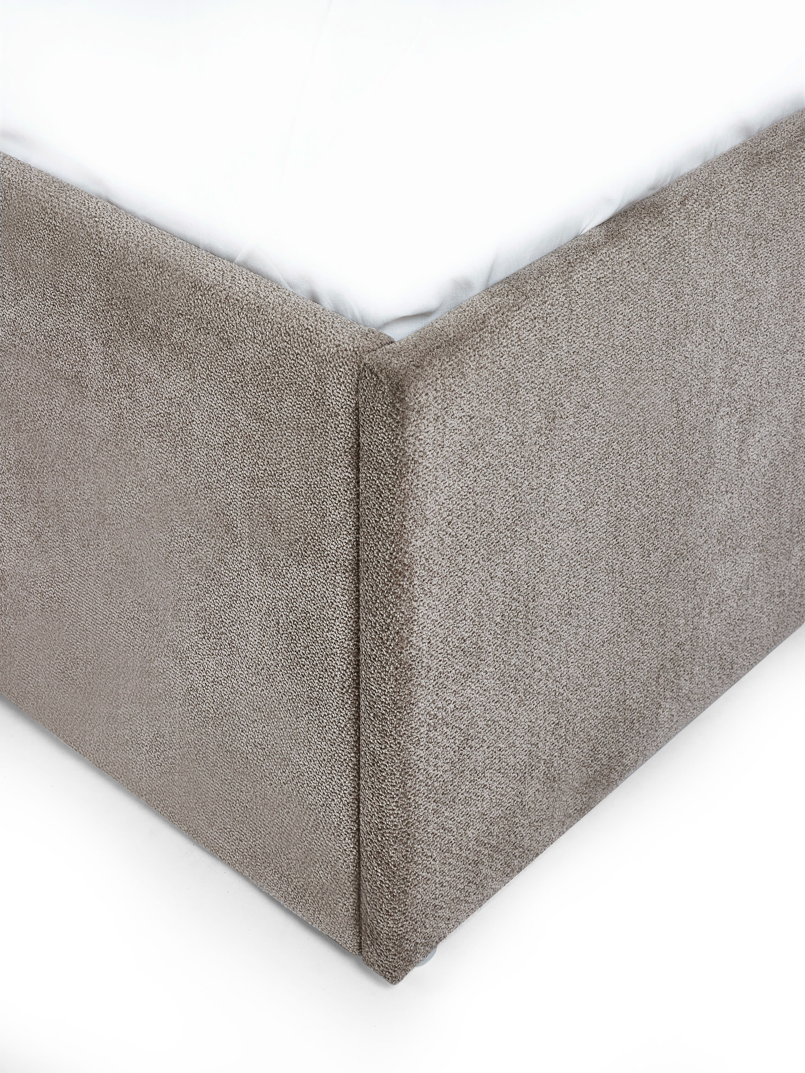 Eloise bed: upholstered corner of the grey chenille base, close up