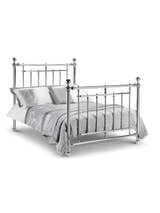 Julian Bowen Empress chrome bed made up with grey bedding, on a white background