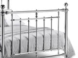 Julian Bowen Empress chrome footboard with ball finial posts and decorative collars, close up