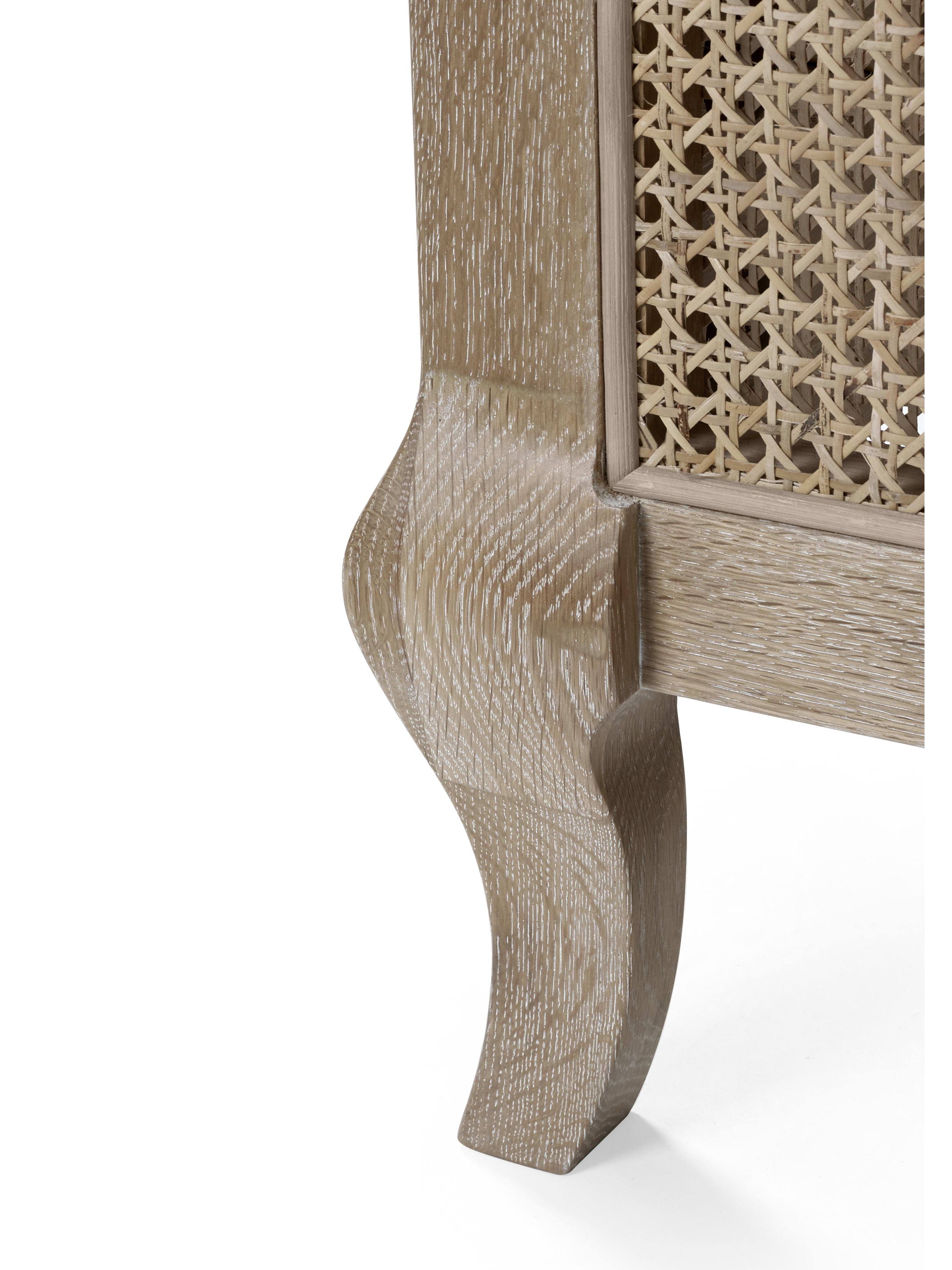 Fleur bed: curved limed oak leg and cane panel, close up