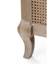 Fleur bed: curved limed oak leg and cane panel, close up