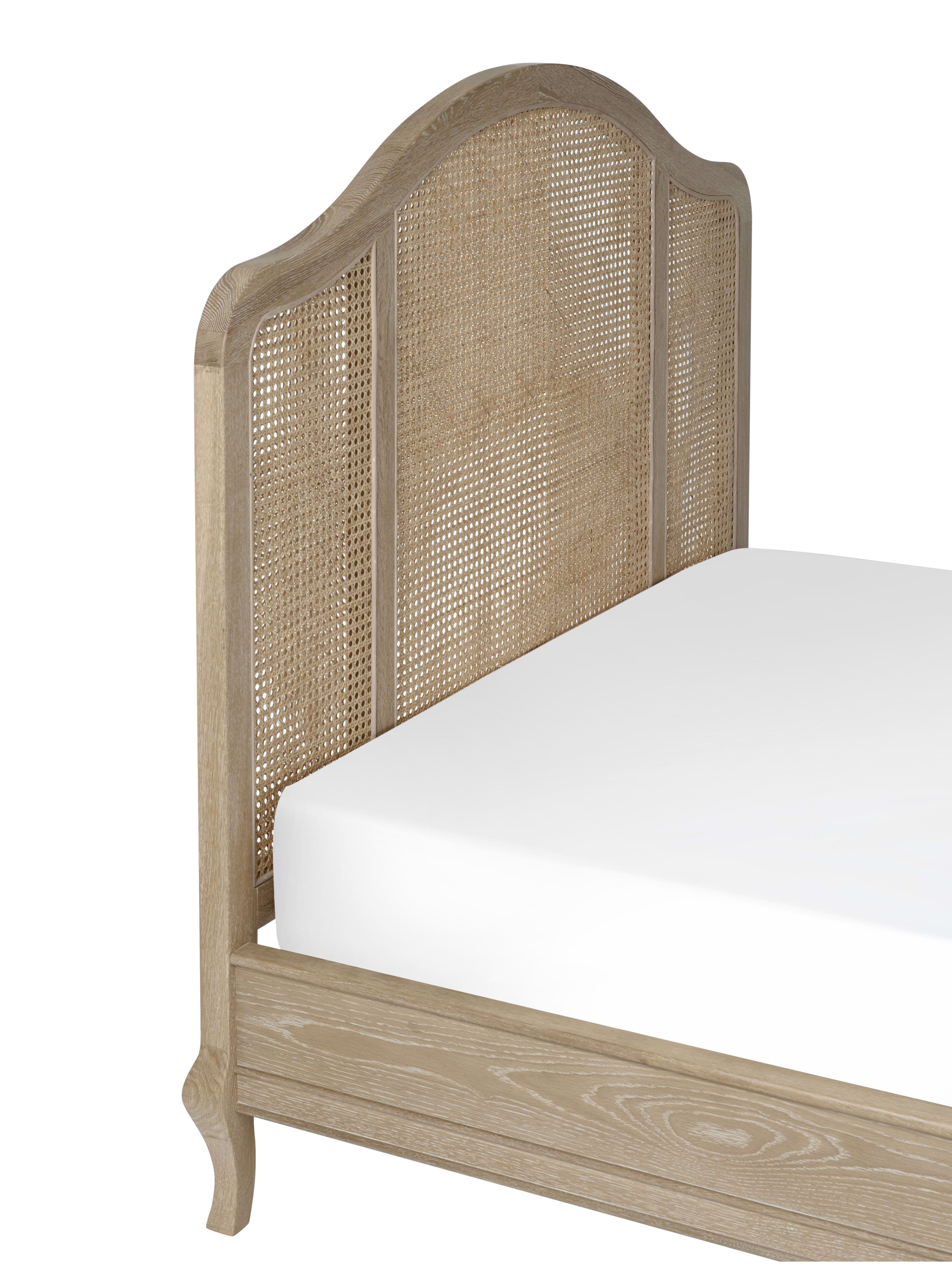 Fleur bed: the arched woven cane headboard, close up