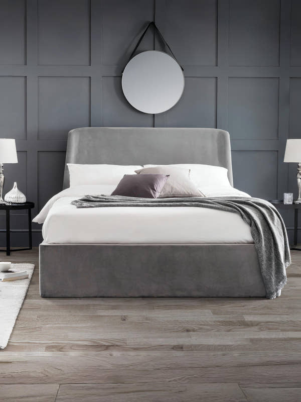 Julian Bowen Frida grey velvet ottoman bed with a curved headboard, in a bedroom