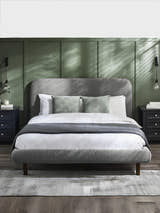 Julian Bowen Hannah grey boucle bed, in a bedroom with green panelled walls