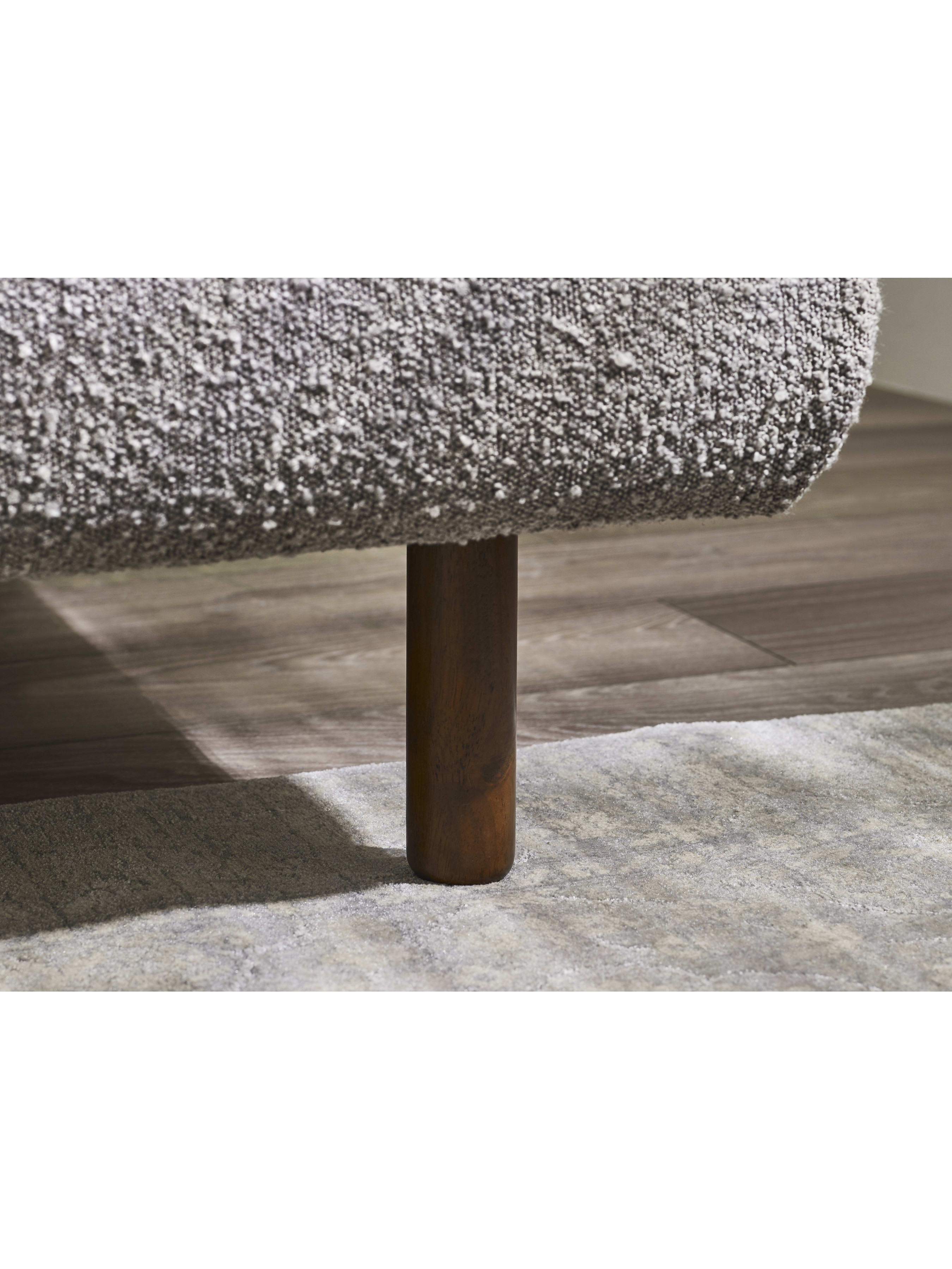 Hannah bed: leg under the grey boucle frame, close up