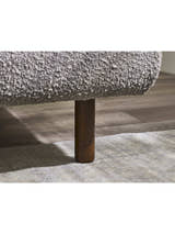 Hannah bed: leg under the grey boucle frame, close up