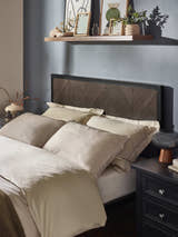 Harrison bed: dark oak herringbone effect headboard in a black frame, behind the pillows