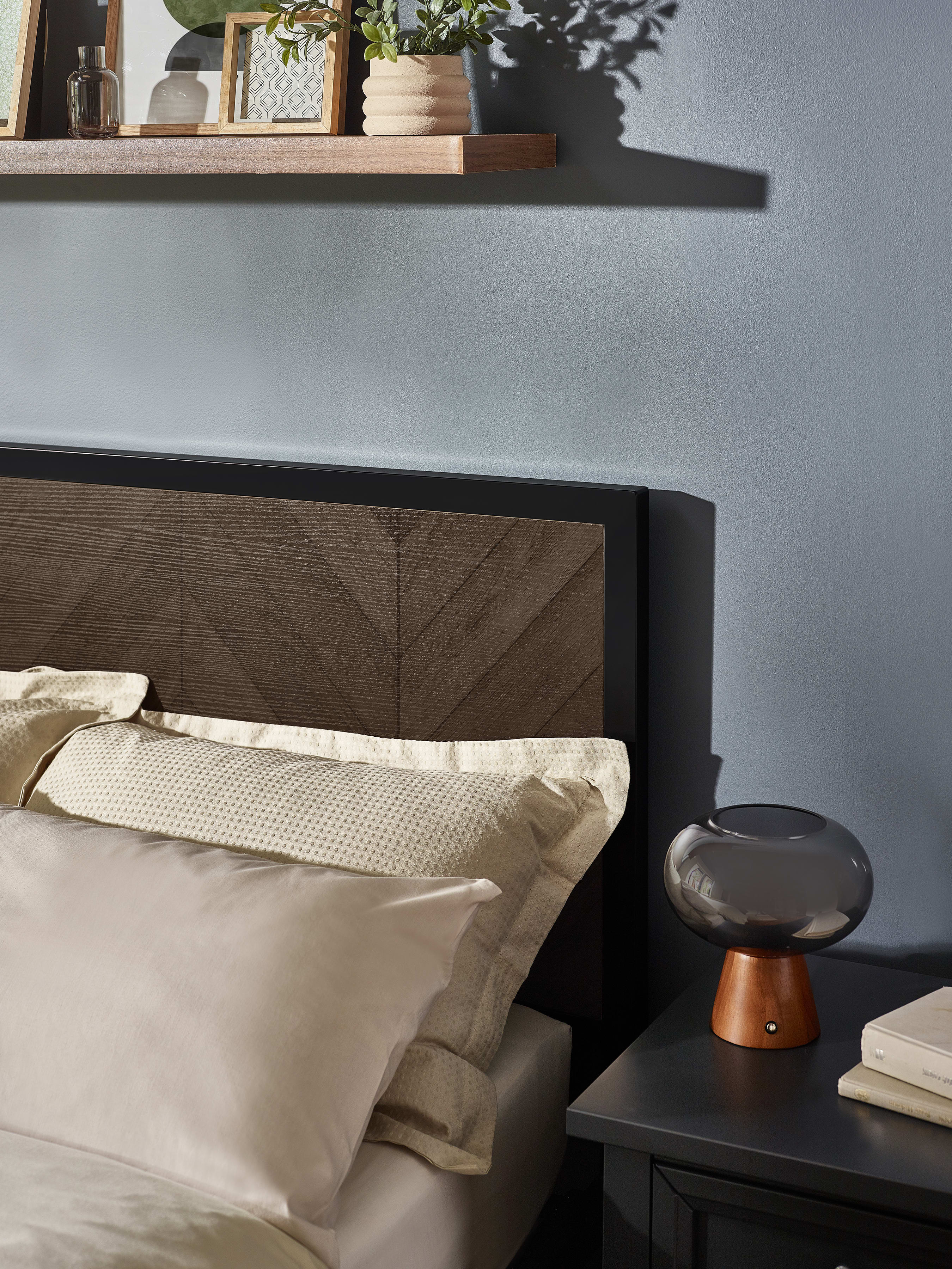 Harrison bed: herringbone headboard panel and black frame, close up