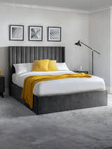 Julian Bowen Langham grey velvet ottoman bed with a tall channelled headboard, in a bedroom