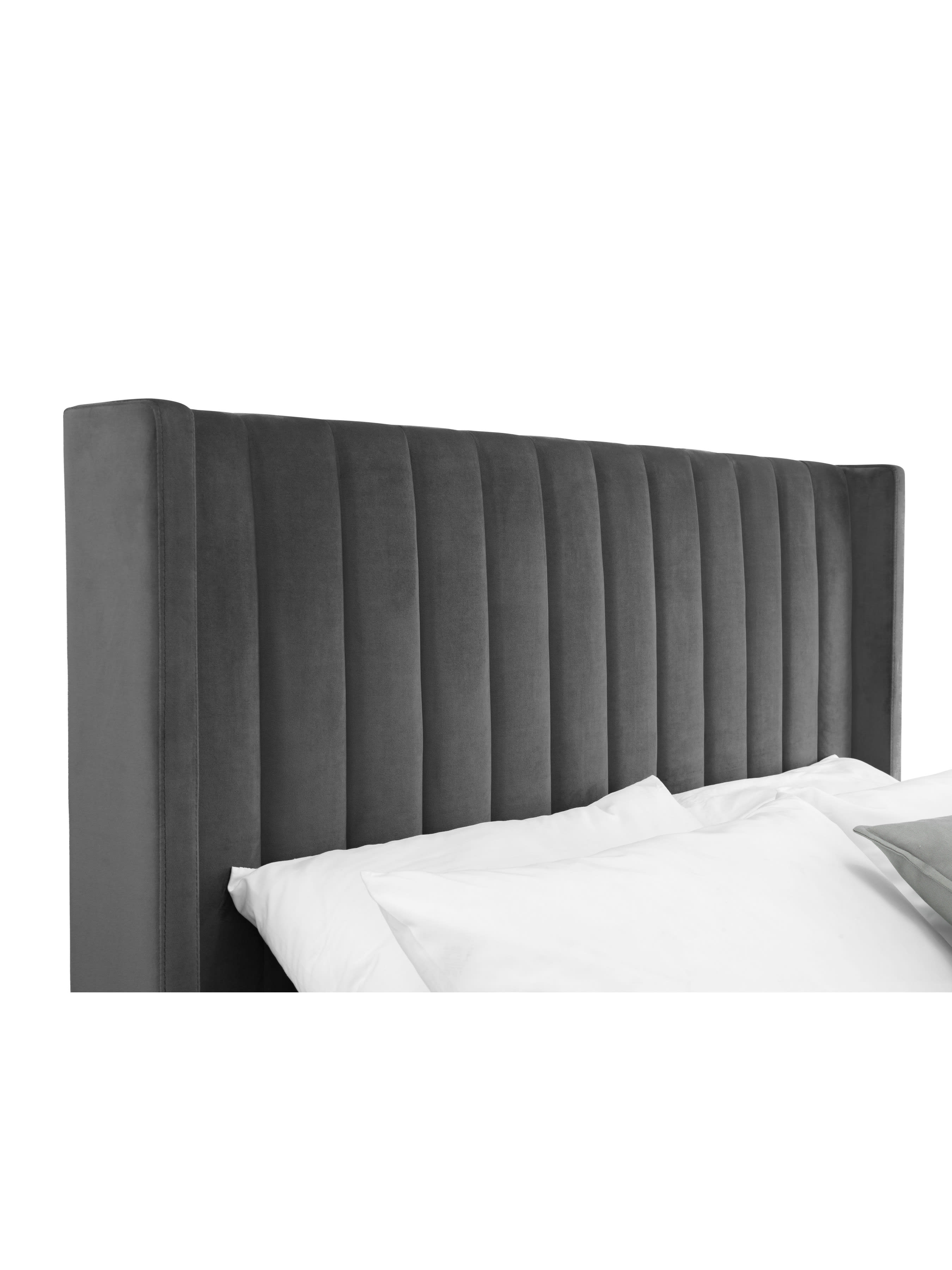 Langham bed: winged grey velvet headboard in vertical channels, close up