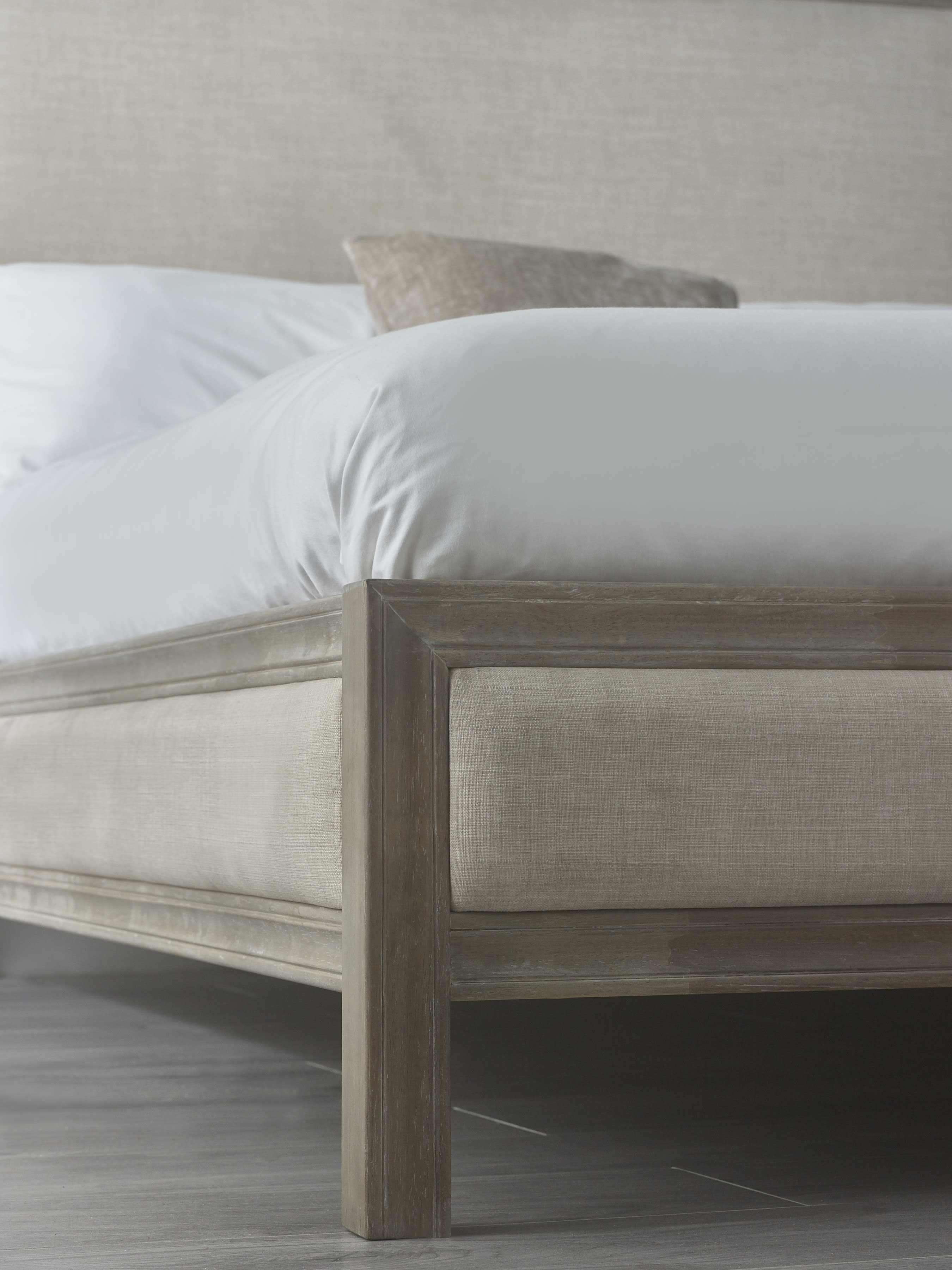 Lucie bed: limed oak foot post and linen side panel, close up