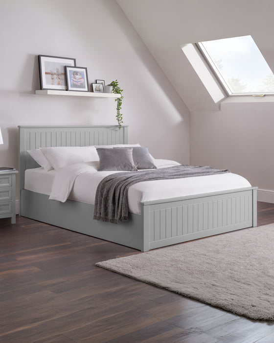 Julian Bowen Maine ottoman bed in dove grey, made up in a loft bedroom
