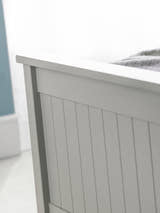 Maine ottoman bed: the dove grey footboard with vertical detailing, close up