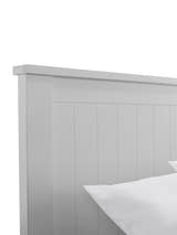 Maine ottoman bed: the top of the dove grey panelled headboard, close up