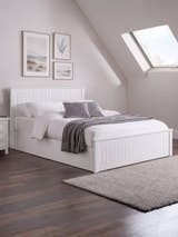 Julian Bowen Maine ottoman bed in surf white, made up in a loft bedroom