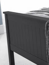 Maine bed: the anthracite footboard with vertical detailing, close up