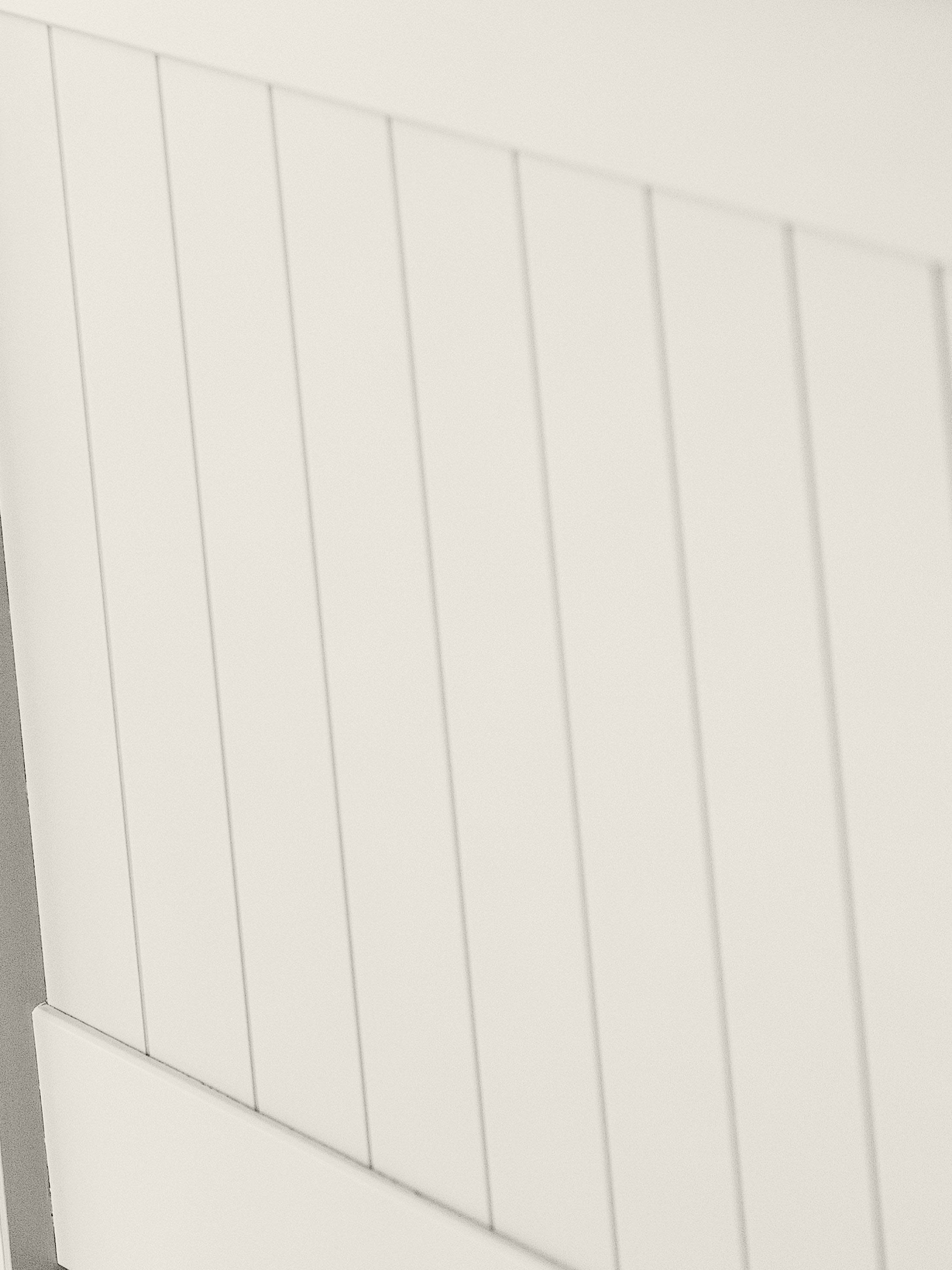 Maine bed: the vertical panelling in surf white, close up