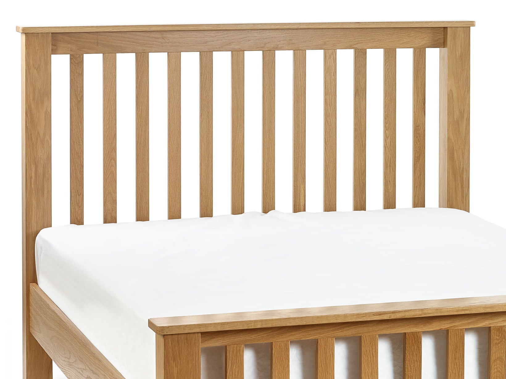 Julian Bowen Mallory oak slatted headboard above a bare mattress, close up